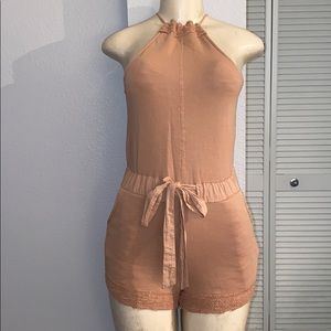 New without tags Woman’s tan romper. York street.